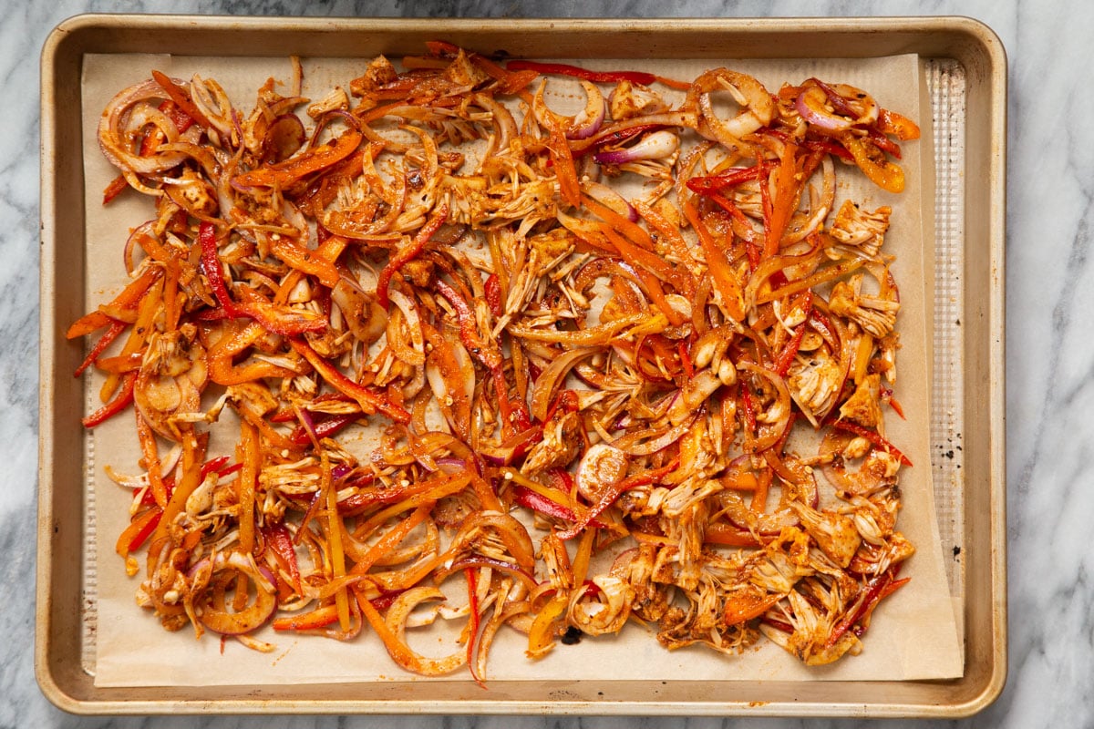 seasoned jackfruit and veggies on a baking sheet