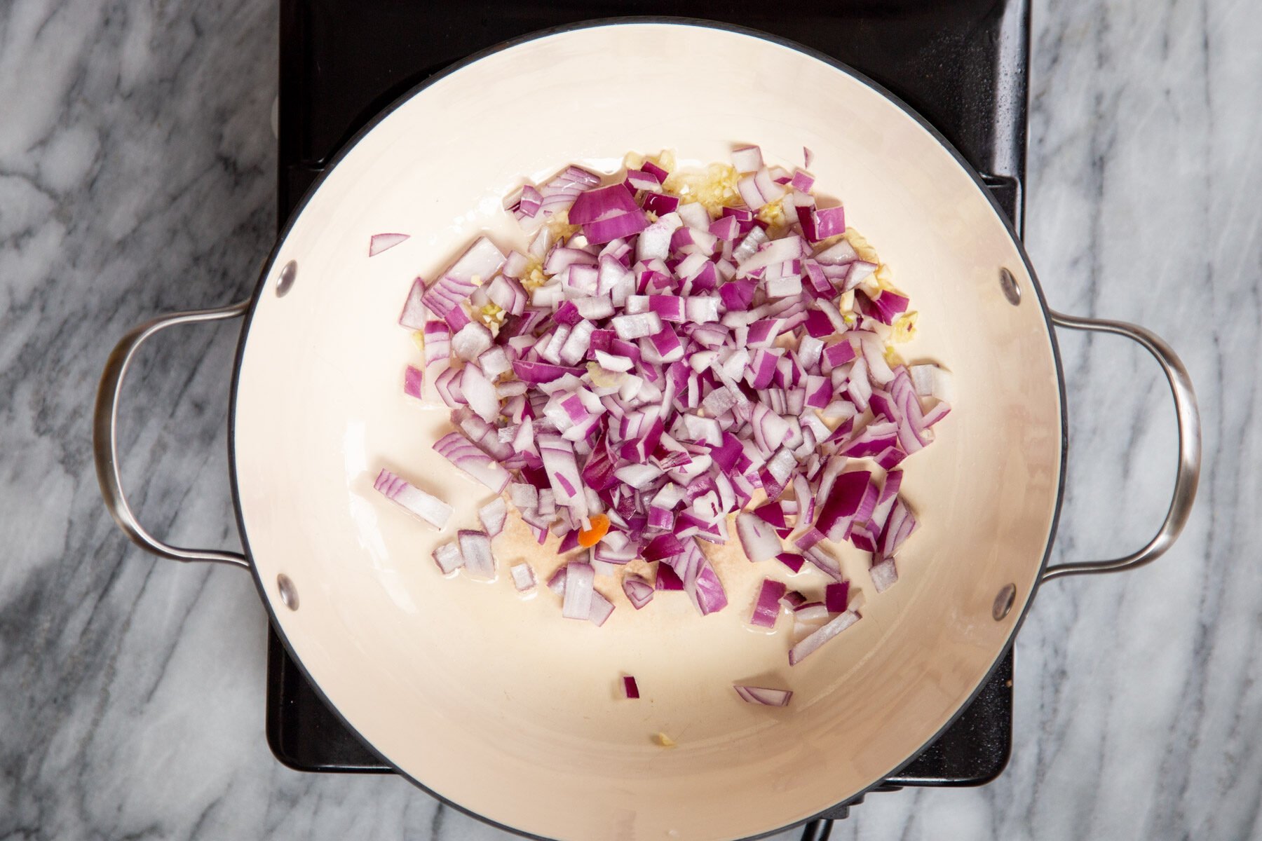 onions and garlic in a sauteeing pan
