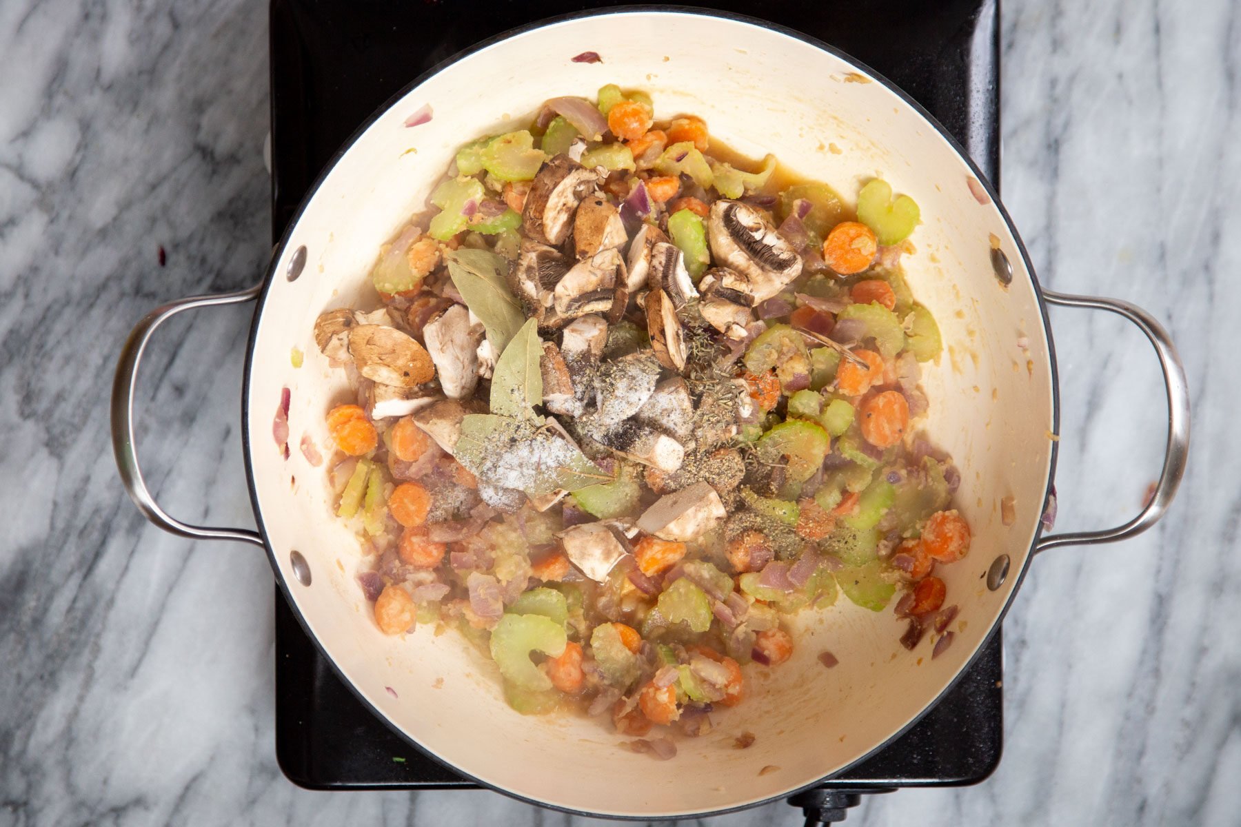 veggie frying in a deep sauteeing pan