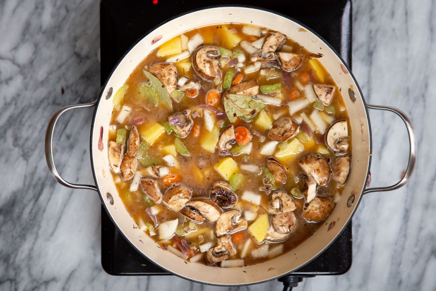 a pot of vegan Irish Stew on a hot plate