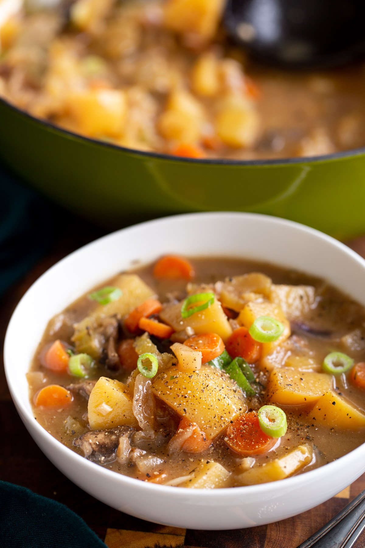 a bowl of Irish Stew with potatoes, carrots and mushrooms