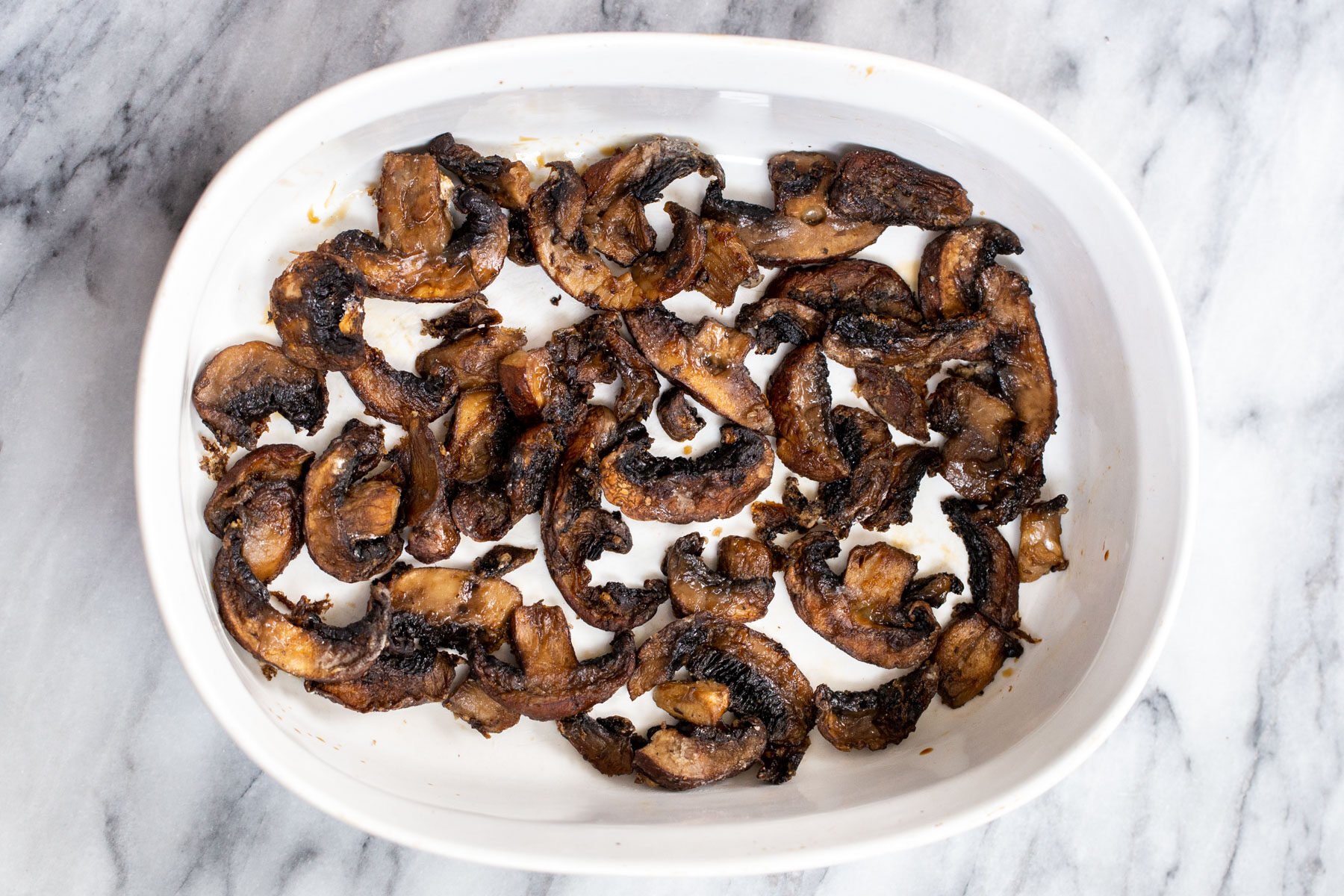 baked mushroom slices in a casserole dish