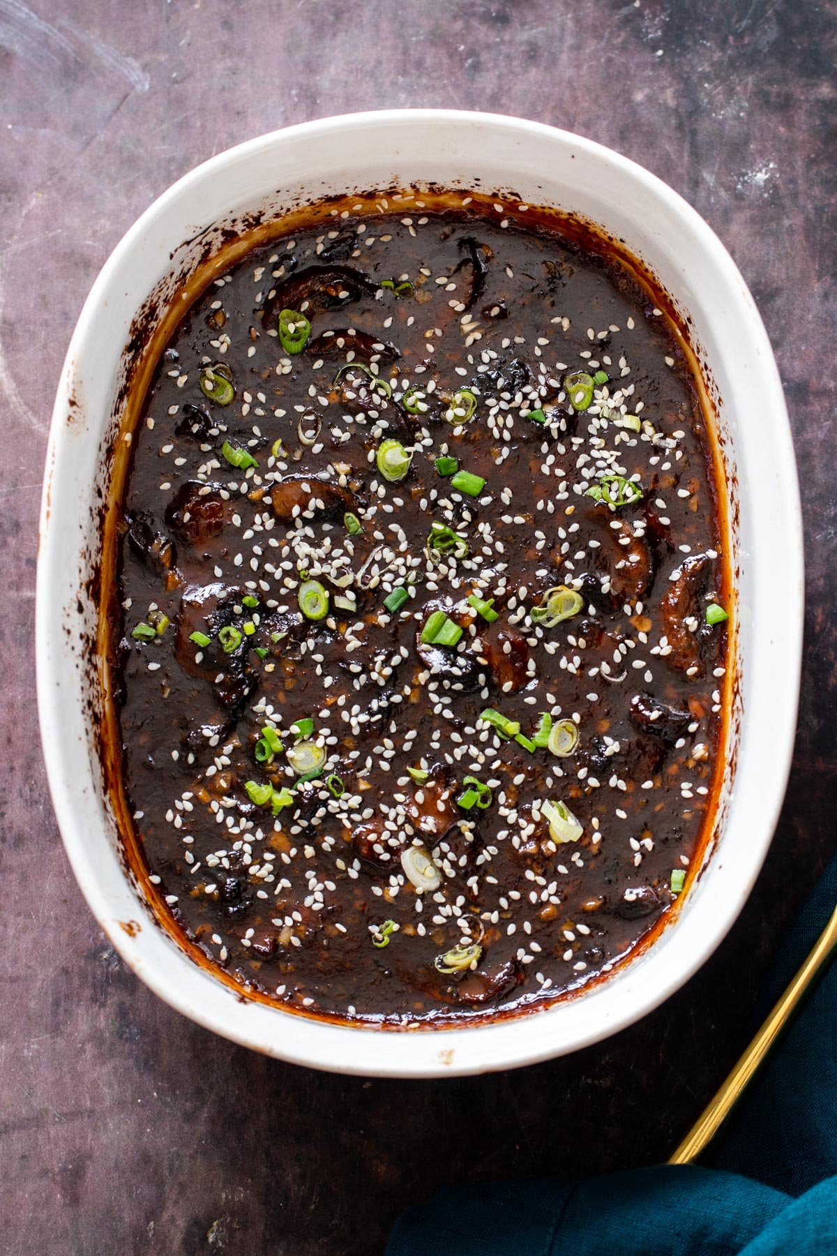 a casserole dish with baked sticky sesame mushrooms
