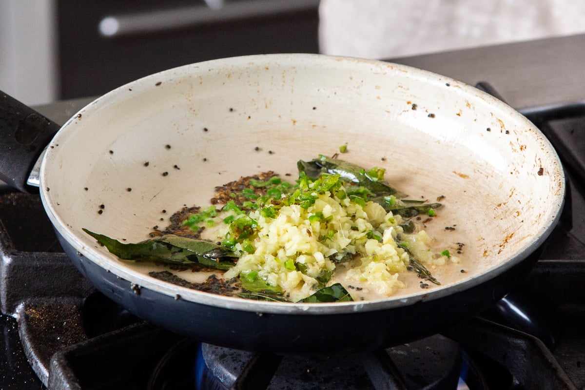 spices, chili and ginger in a sauteeing pan