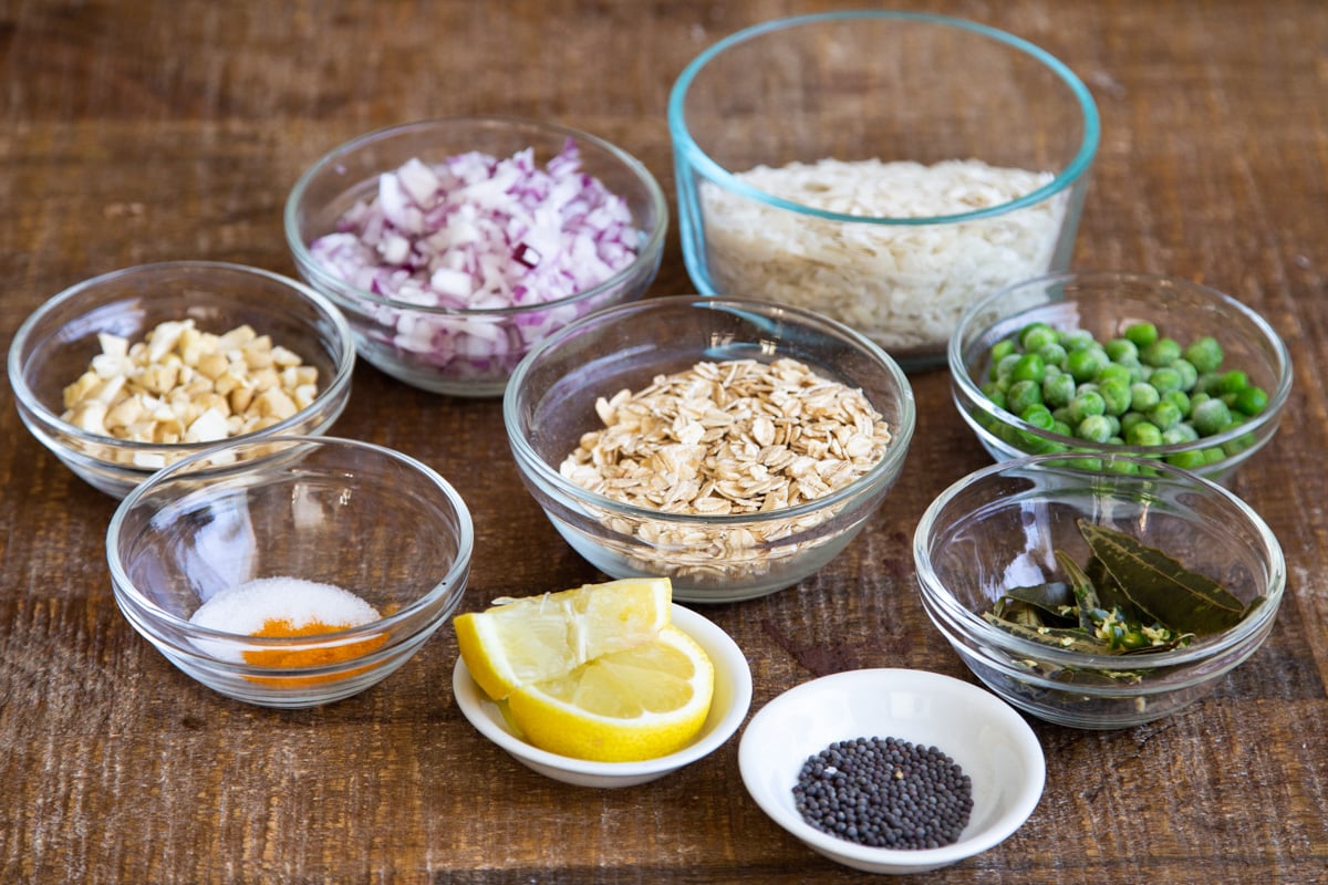 ingredients needed for making kanda poha on a wooden board
