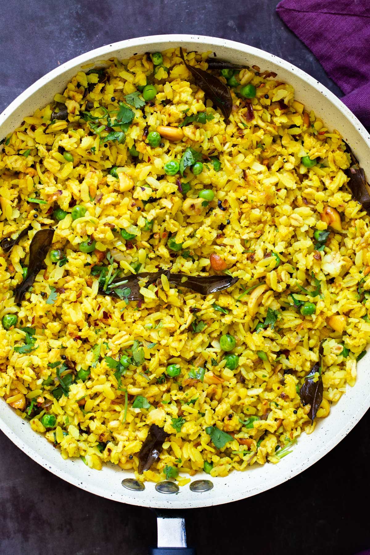 a frying pan with Indian Kanda Poda