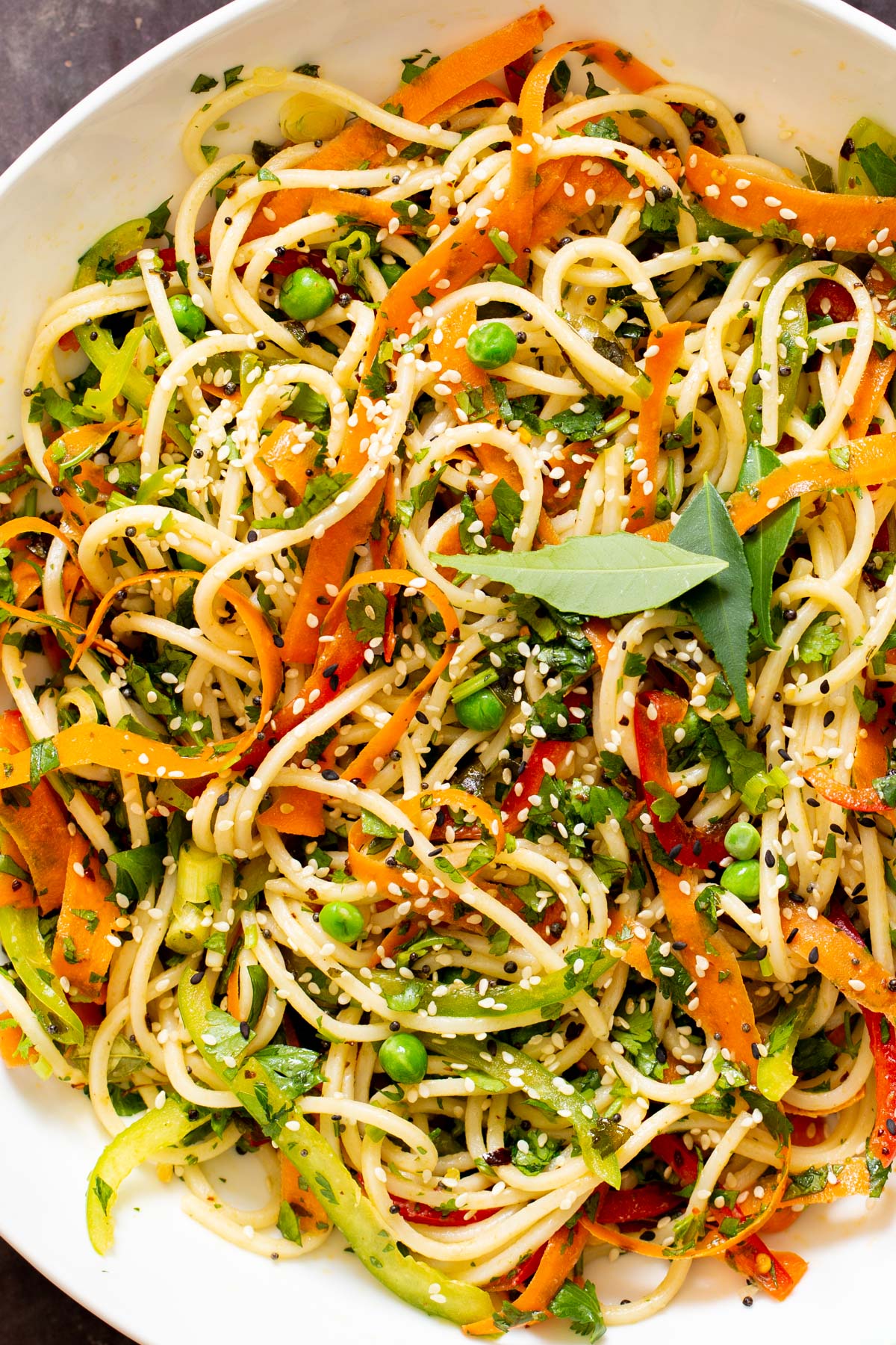 overhead shot of a pasta bowl sprinkled with sesame seeds