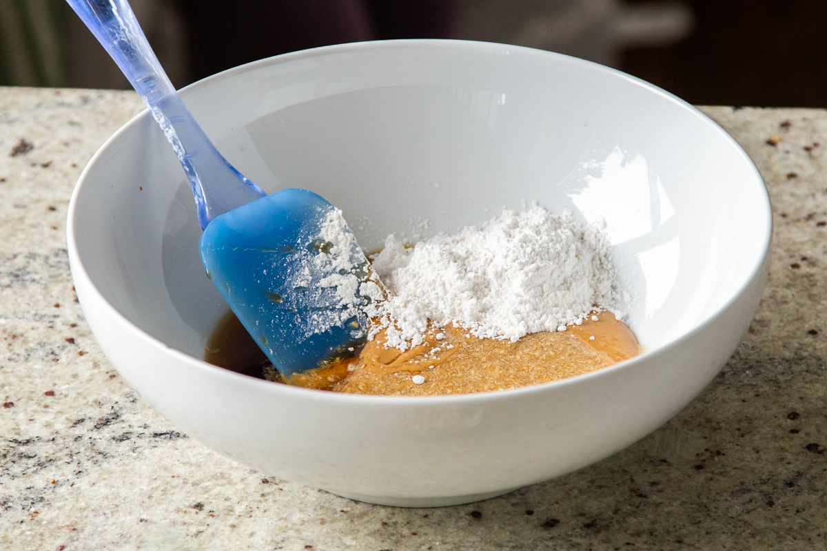 smooth peanut butter with icing sugar in a small white bowl