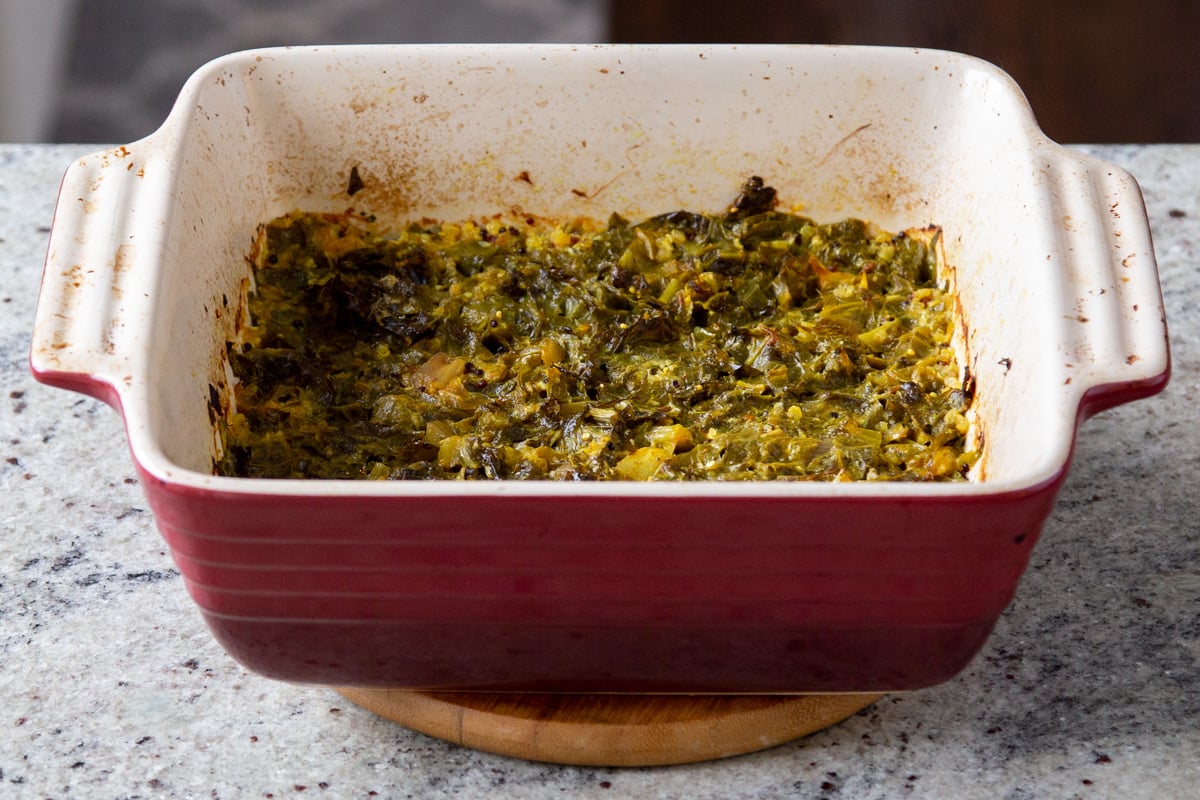 mustard greens in a red casserole dish