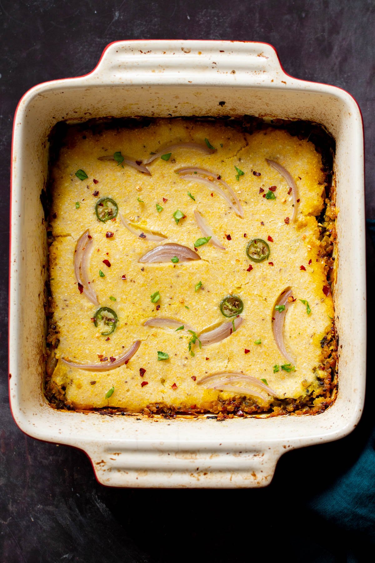 overhead shot of a casserole dish with vegan saag cornbread casserole