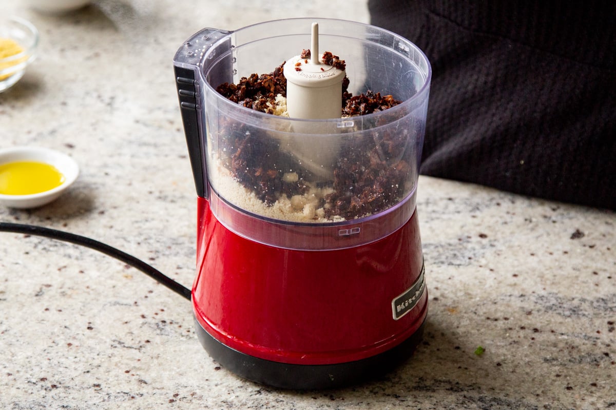 a small food processor with peanut sauce ingredients
