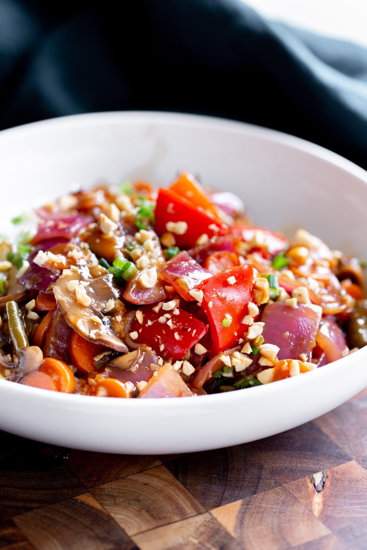 side view of a plate with sweet & sour Indo Chinese veggies served with rice