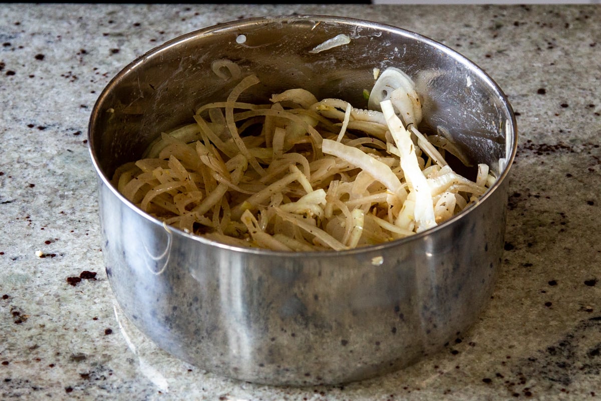 sliced onions tossed with butter and spices in an Instant Pot