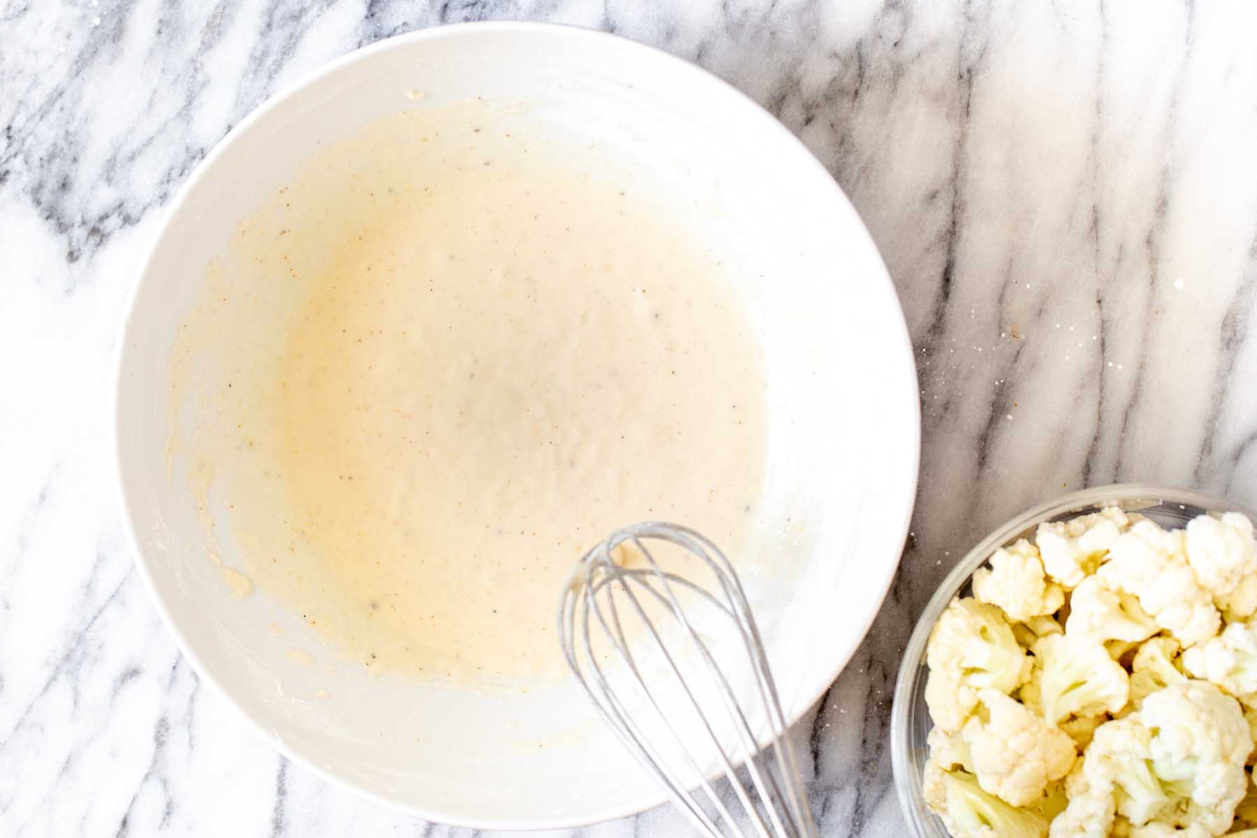 cauliflower batter in the bowl after mixing