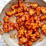 cauliflower tossed in gochujang sauce in the pan