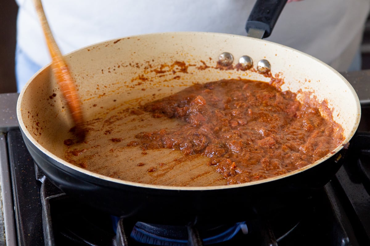 base for vegan patiala gravy simmering in a sauteeing pan