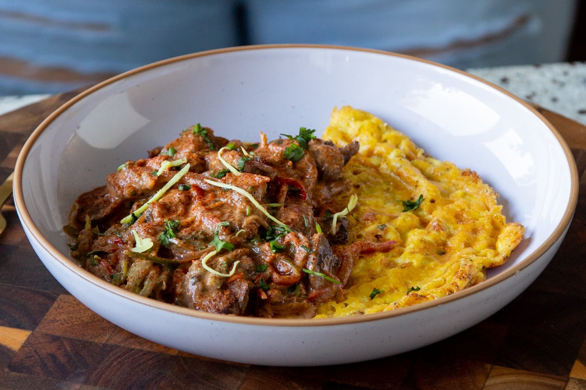 vegan mushroom patiala served with a folded vegan omelet