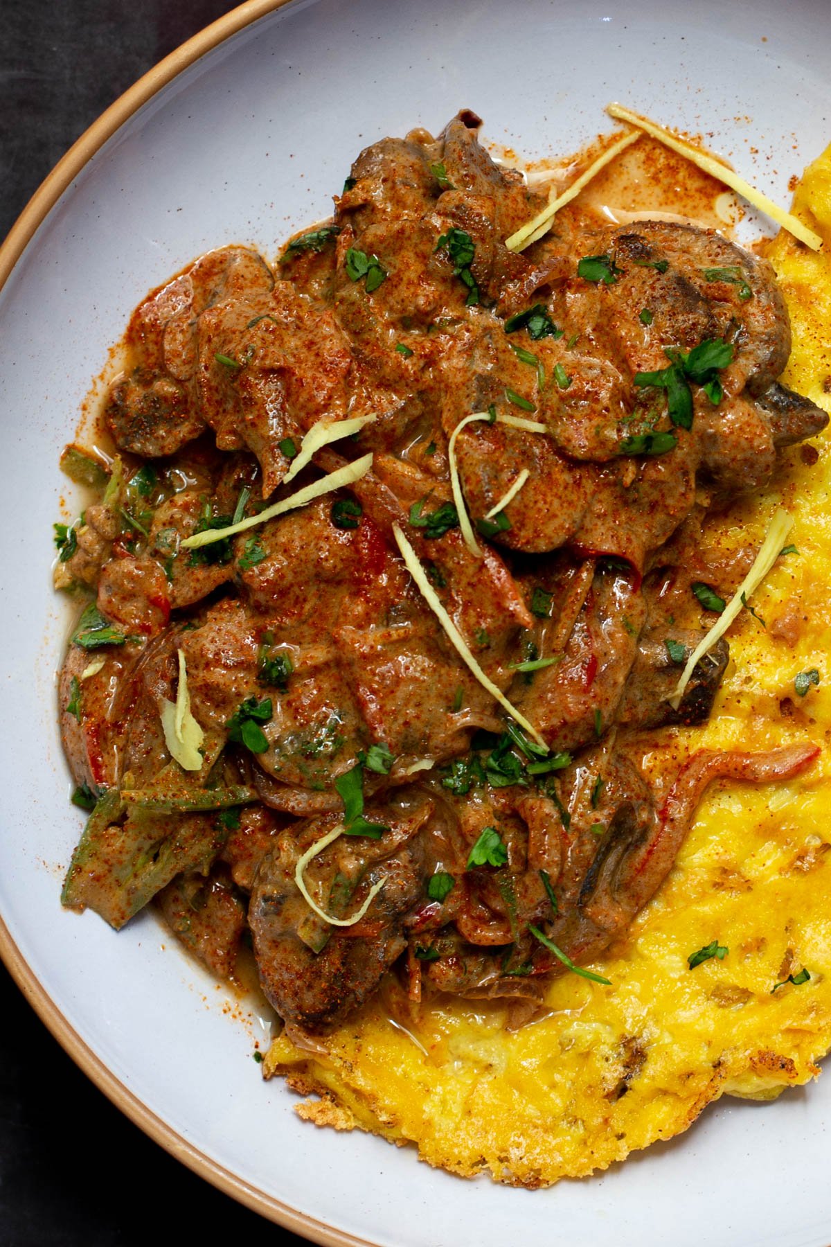 vegan mushroom patiala served alongside a vegan omelet