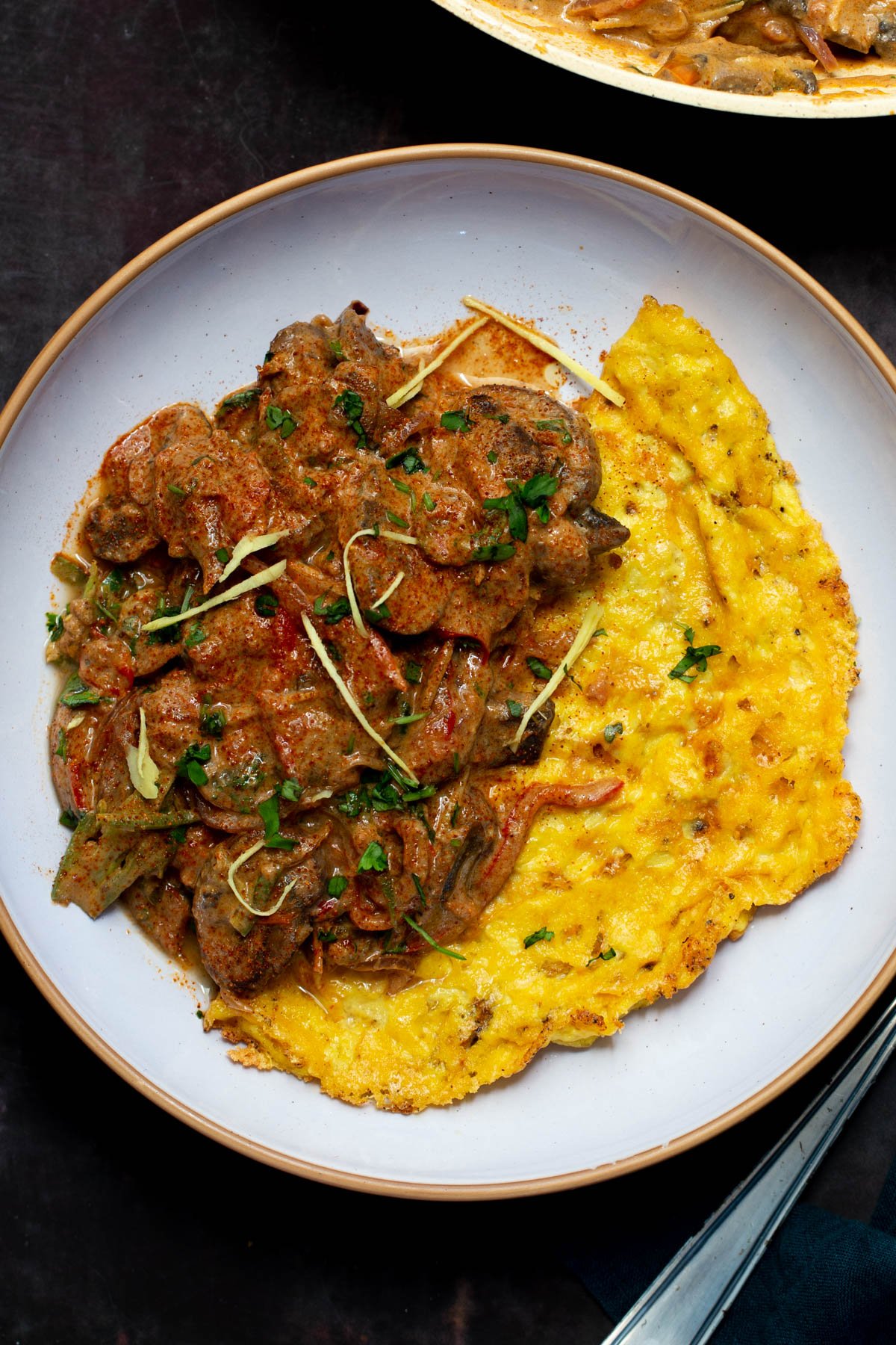 vegan mushroom patiala served alongside a vegan omelet