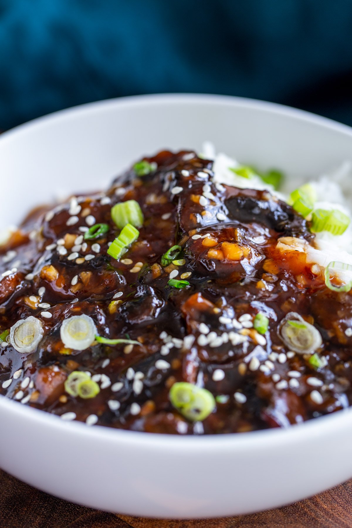 sticky sesame mushrooms served with rice and sprinkled with sesame seeds and green onions