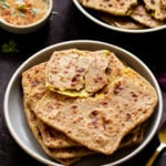 serving platters of aloo paratha with chutney for dipping