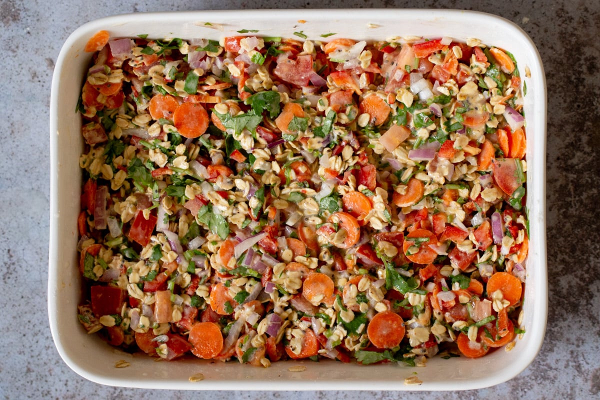 savory baked oats mixed up in the pan before baking