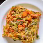 close-up of a piece of savory baked oatmeal on a white plate
