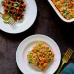 a piece of savory baked oats on a white plate next to the baking pan and a waffle