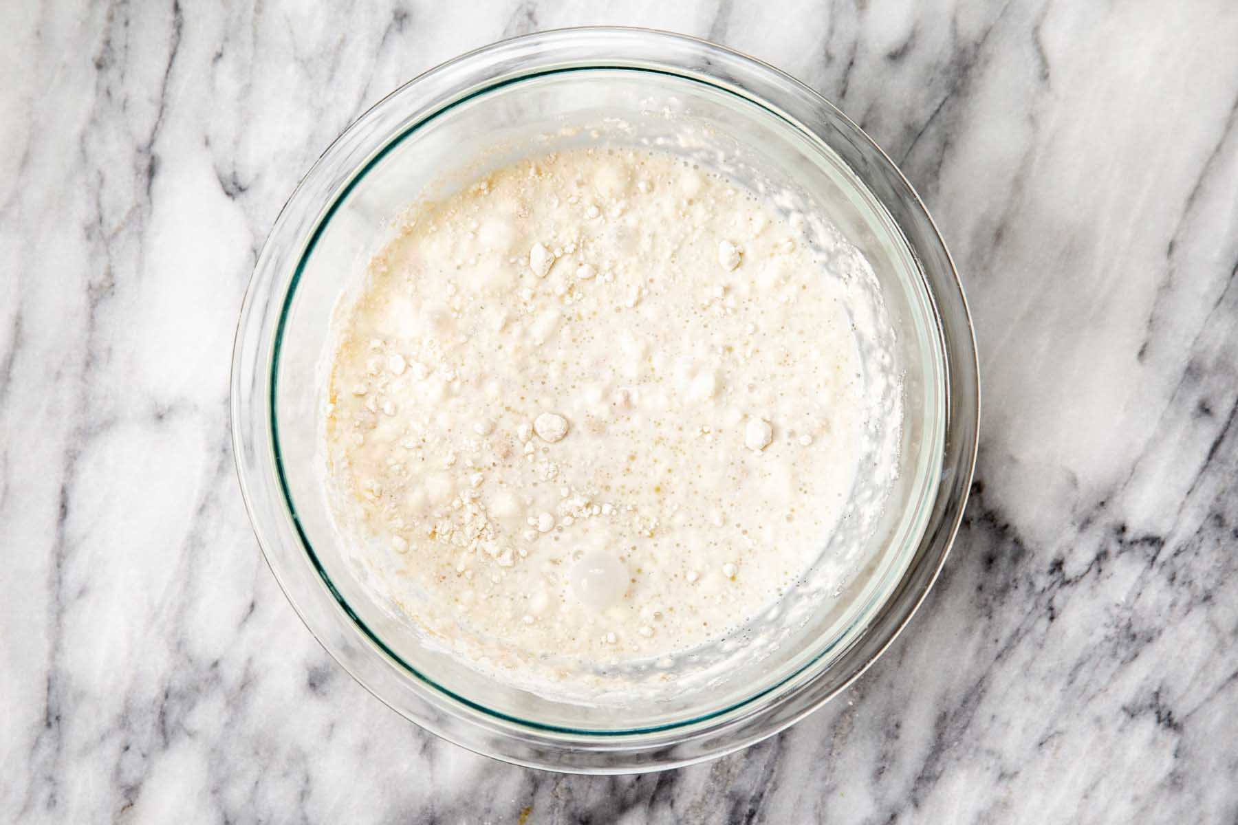 adding flour to the bowl