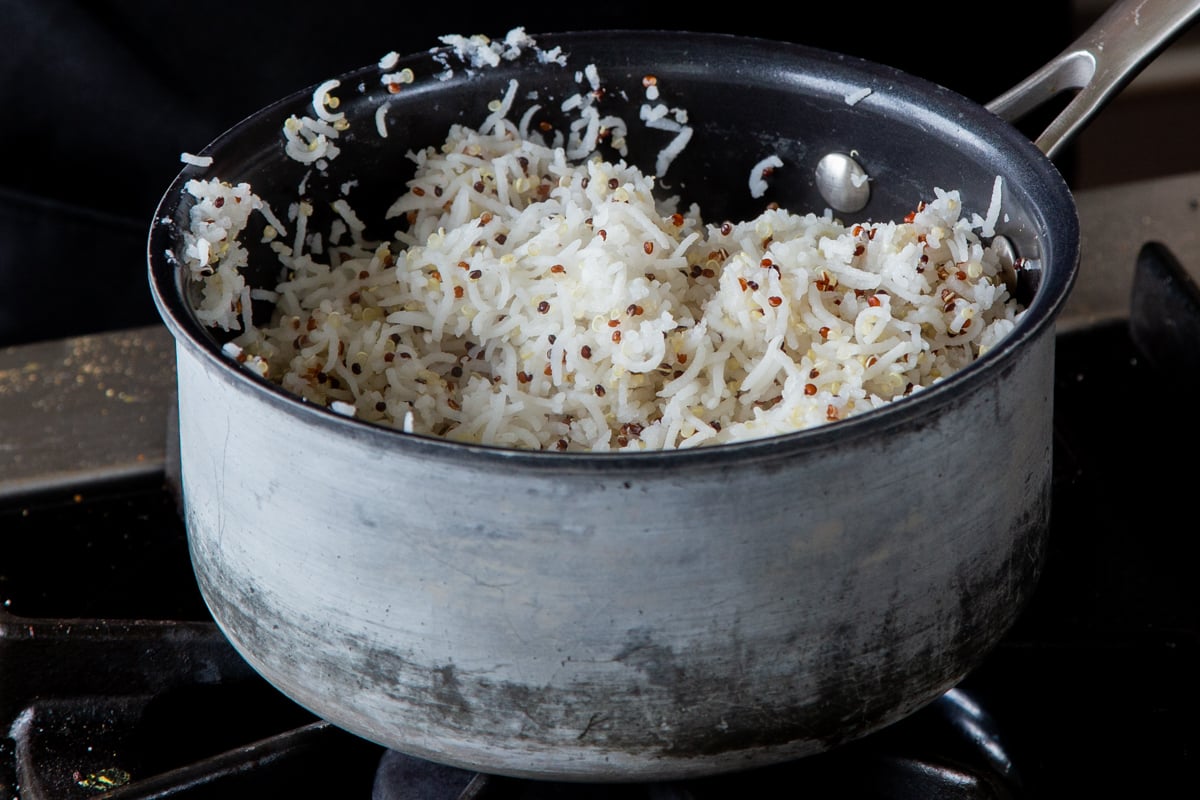 rice and quinoa in a pot on the stove after cooking