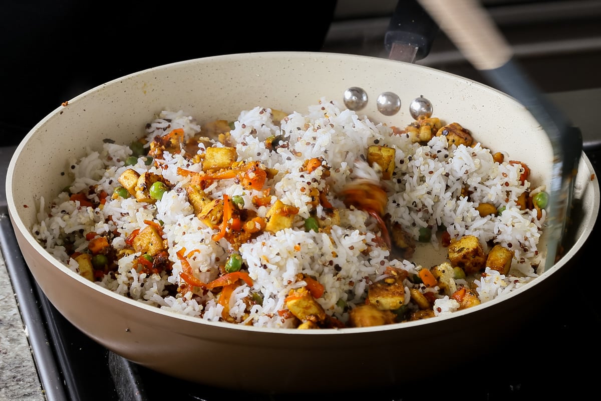 adding rice-quinoa mixture to the pan