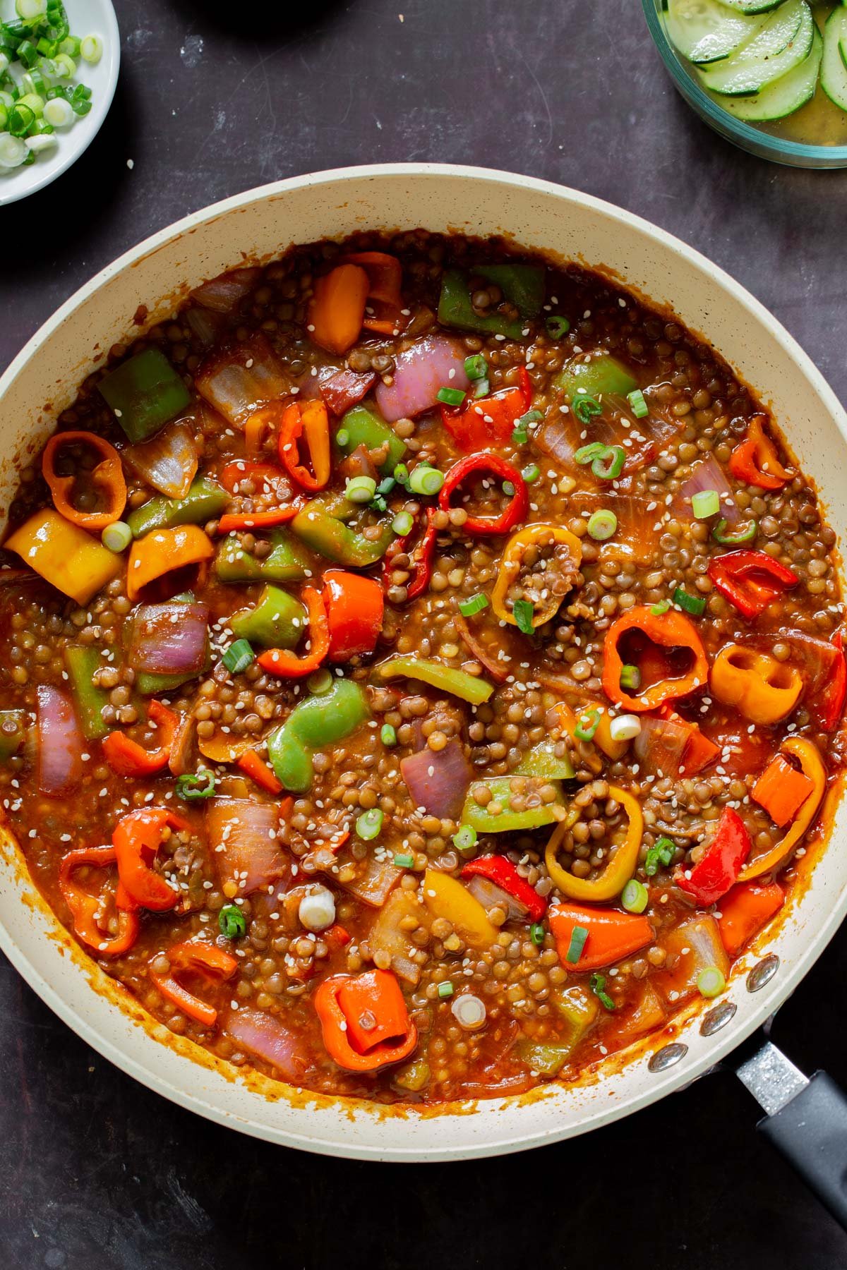 gochujang lentils in the pan with bell pepper and onion