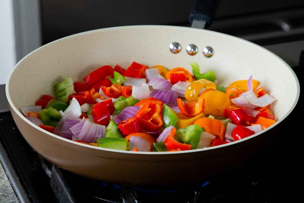 peppers and onions in the frying pan