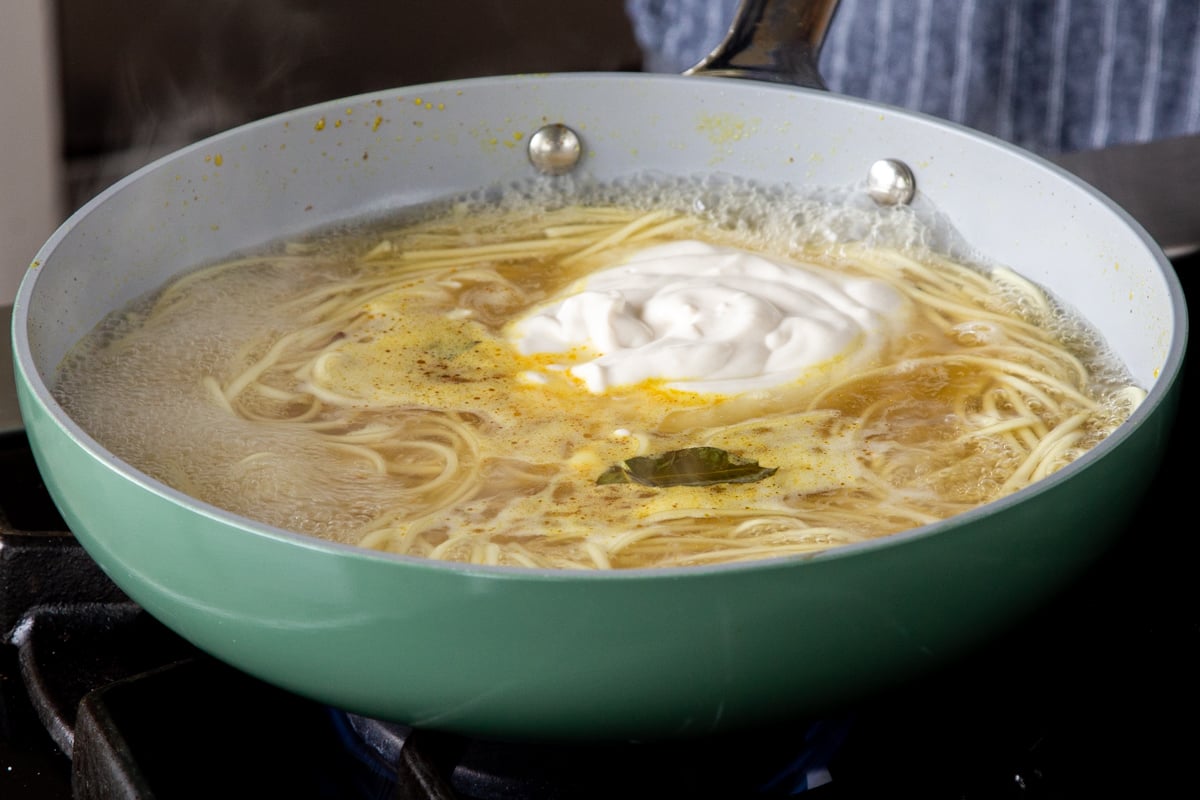noodles in the pan, with the yogurt mixture added