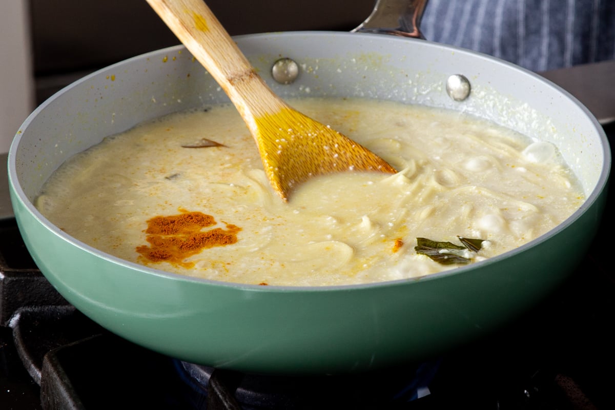 kadhi pasta after stirring yogurt mixture into the sauce