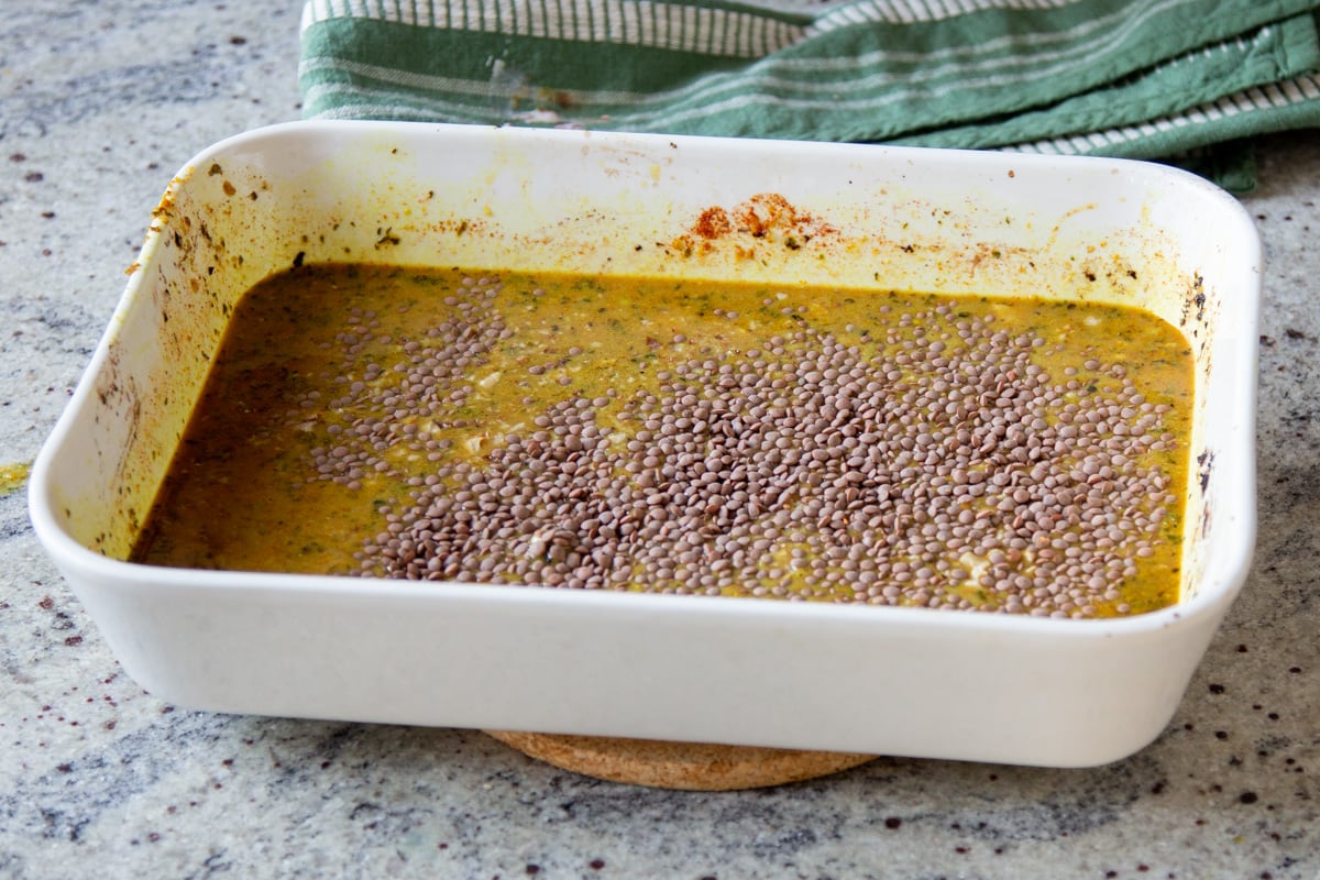 lentils added to the baking pan before baking