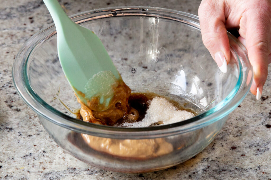 sugar added to the bowl with the peanut butter