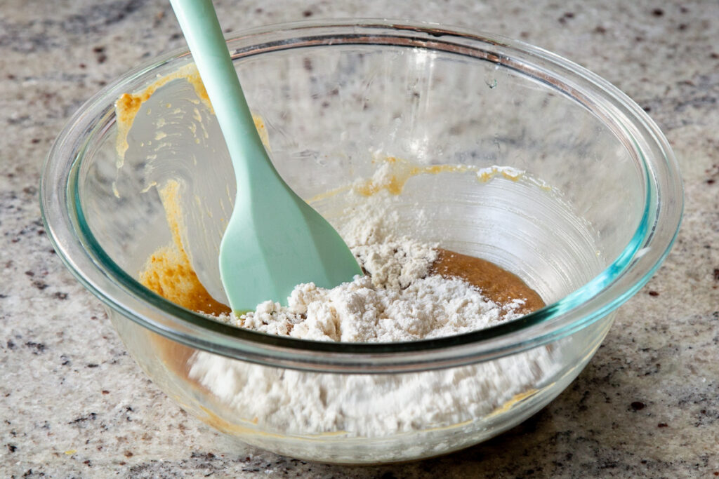 adding dry ingredients to the wet ingredients