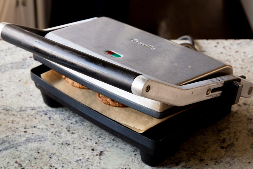 panini press, closed, with cookies inside