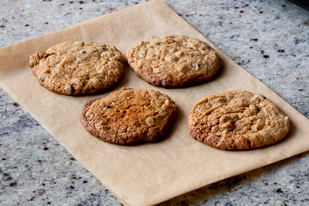 finished cookies cooling on parchment paper on the counter