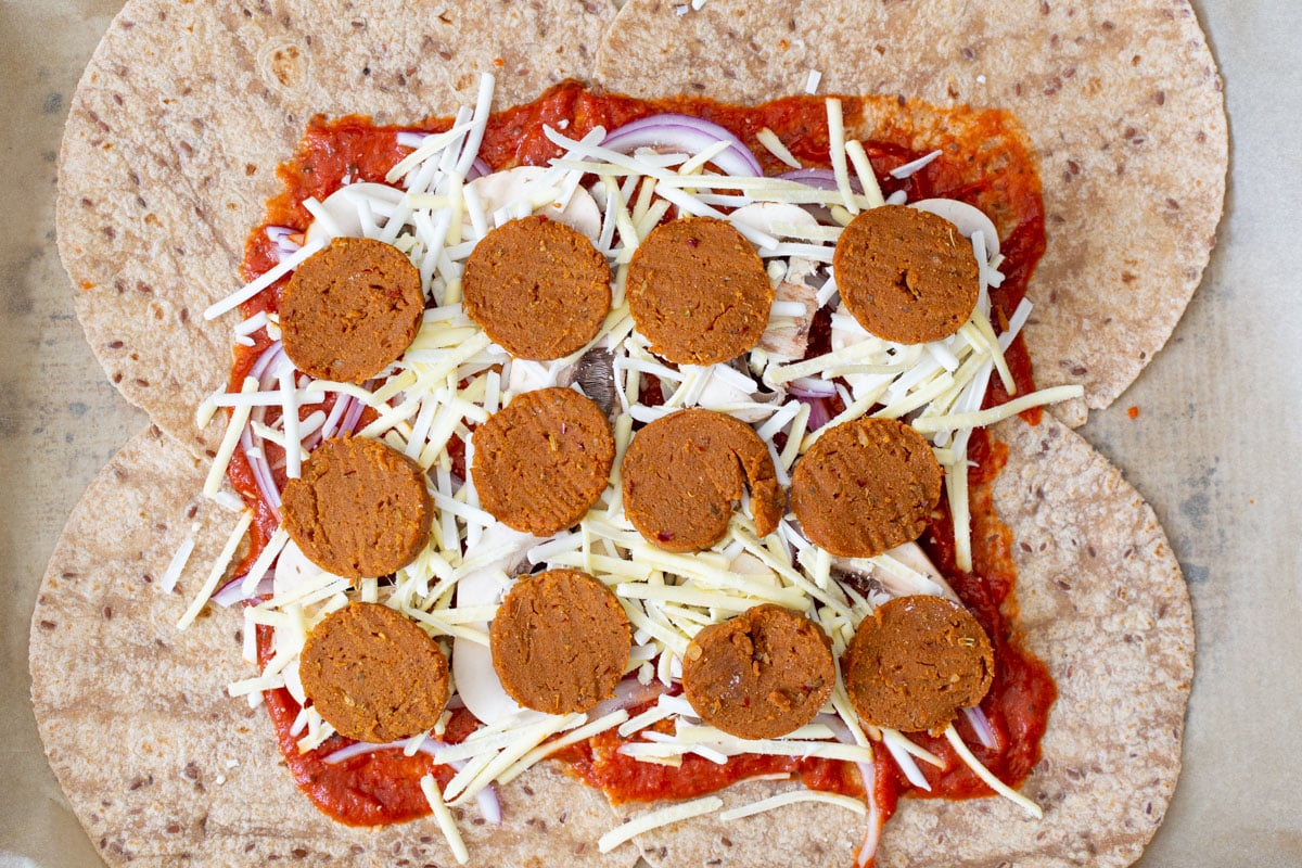 pepperoni placed on top of the cheese