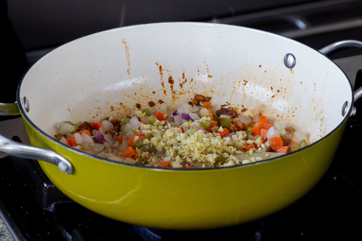 garlic and spices added to the pan, before cooking