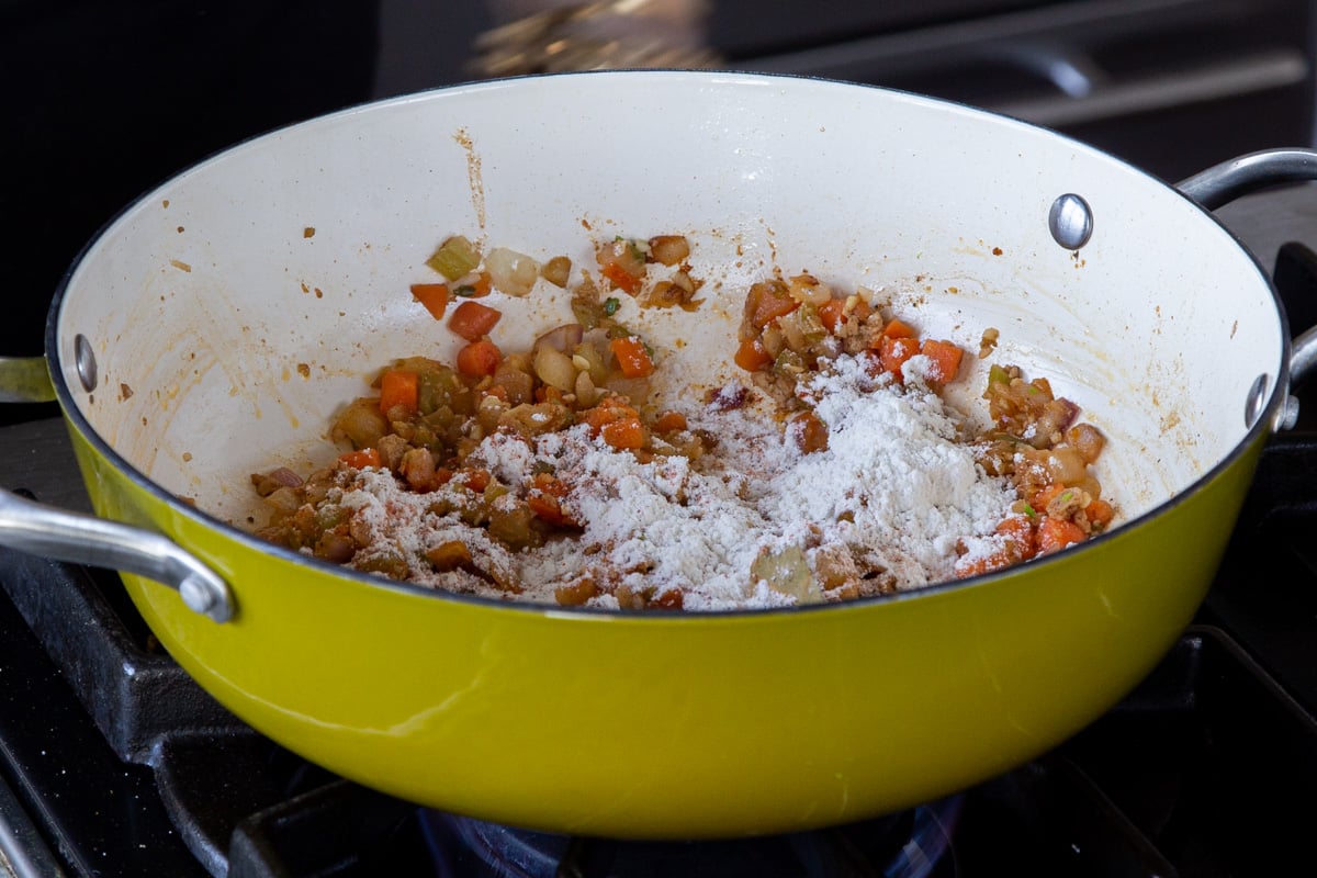 adding flour to the pan