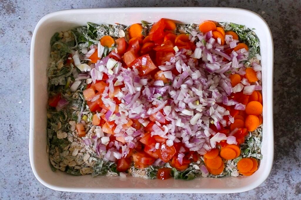adding veggies to the savory oats mixture