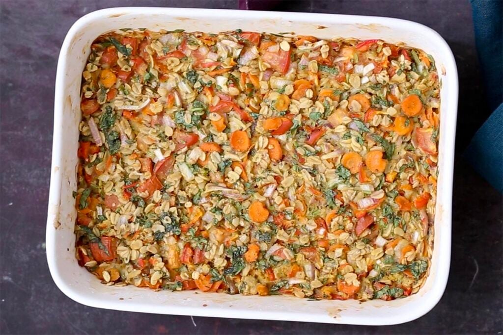savory baked veggie oats in the pan after baking