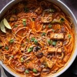 birria ramen in the pan after adding garnishes