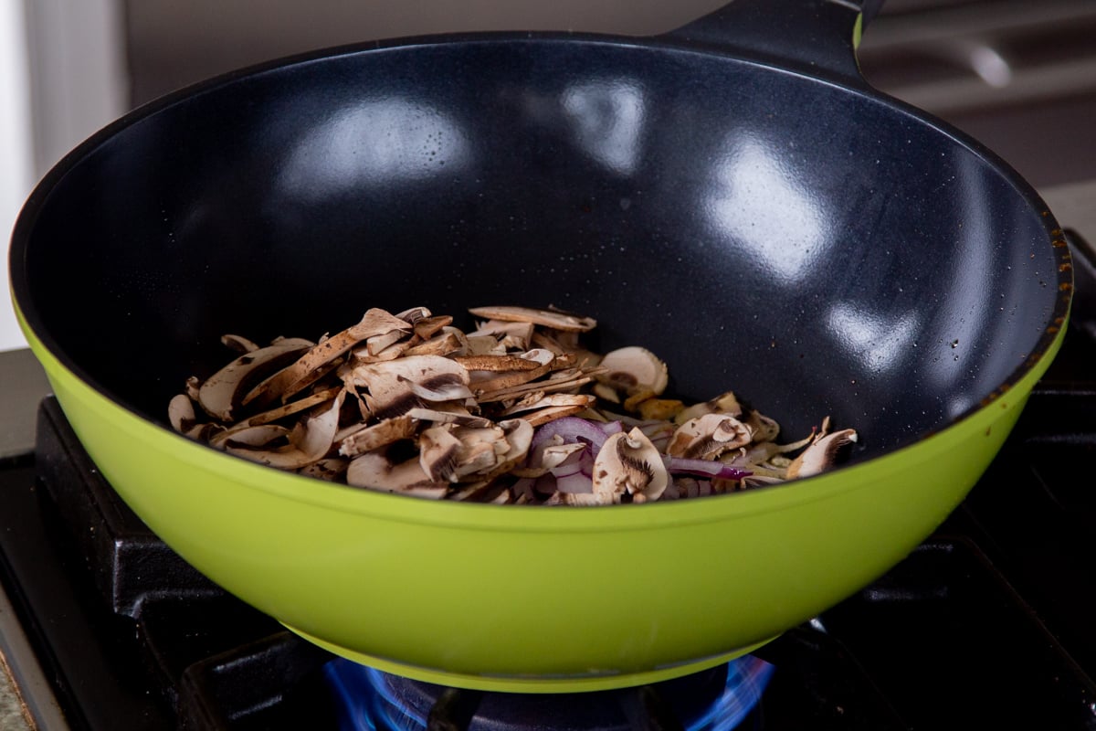 mushrooms in a wok, before cooking