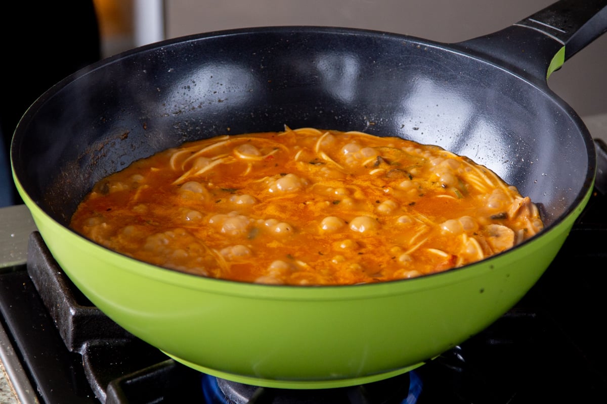 simmering the butter ramen broth with the noodles