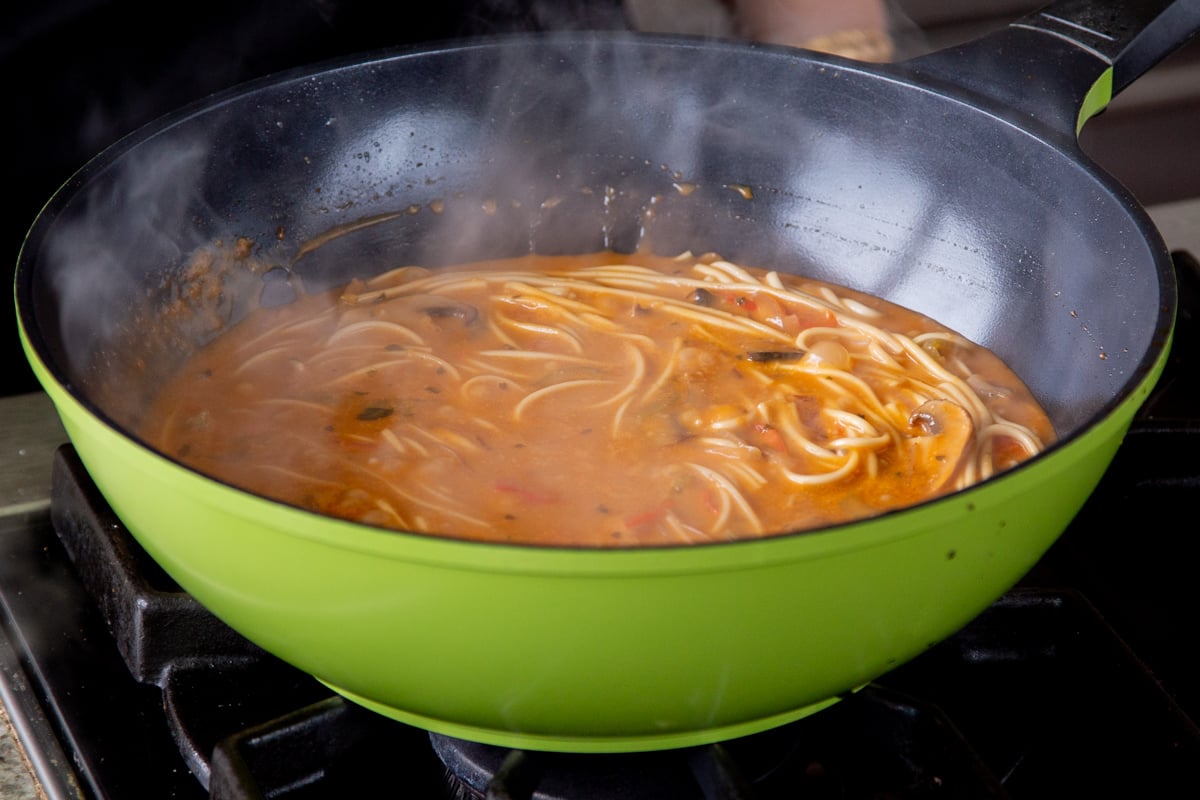 butter ramen noodles, after cooking but still in the wok