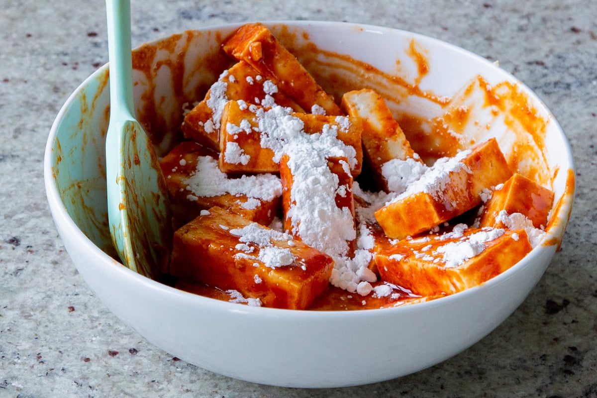 adding cornstarch to the gochujang tofu